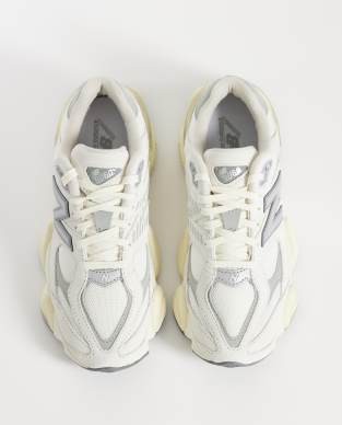 New Balance 9060 sneakers in white with gray metallic detail